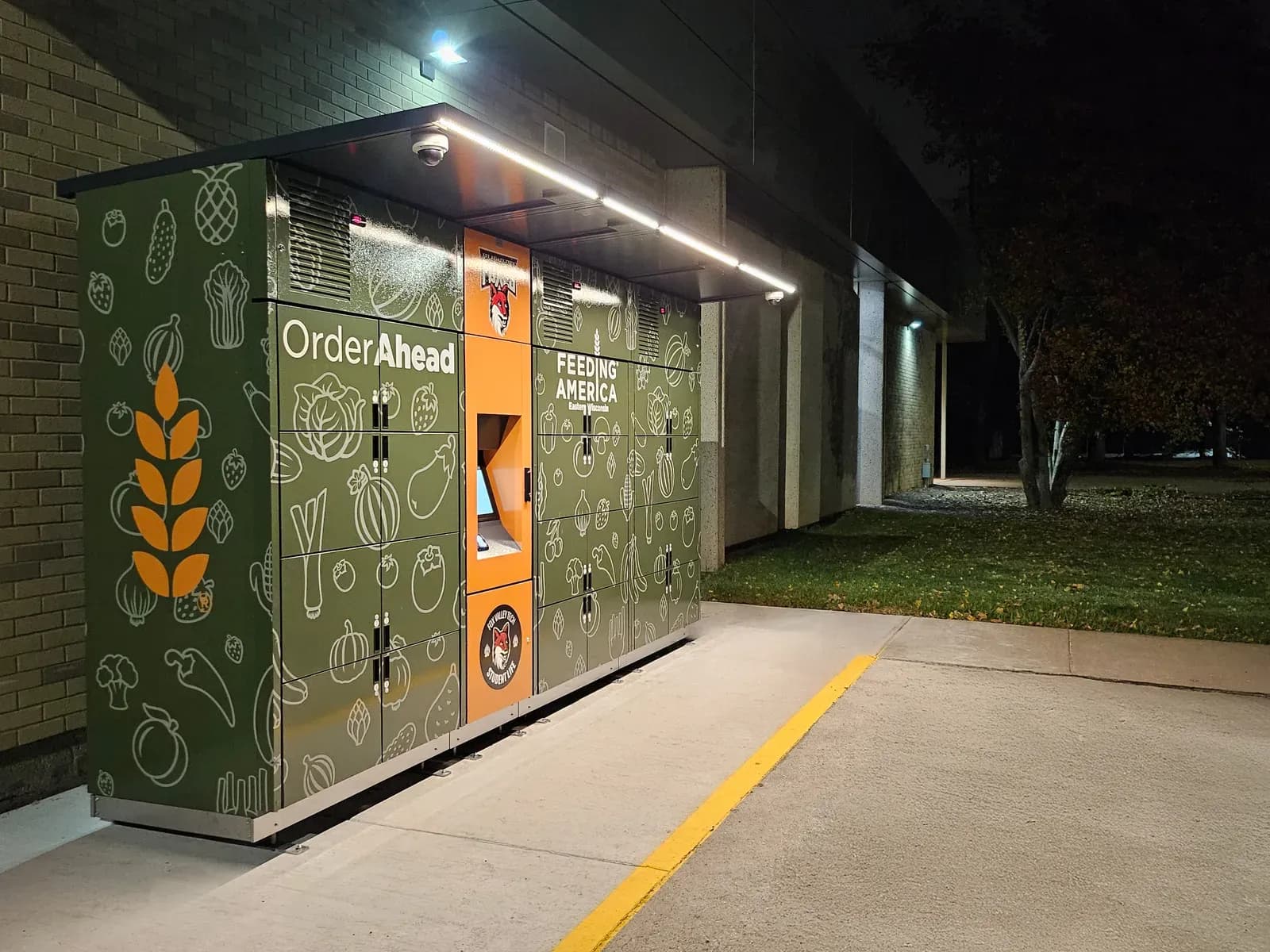 Feeding America Eastern Wisconsin OrderAhead lockers at night with the canopy LED lighting on
